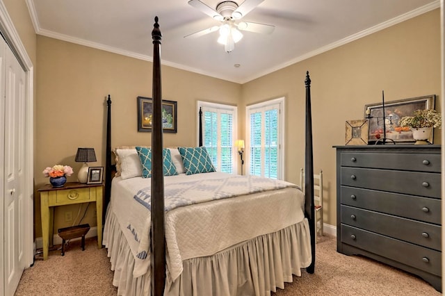 bedroom with crown molding, light colored carpet, a closet, and ceiling fan