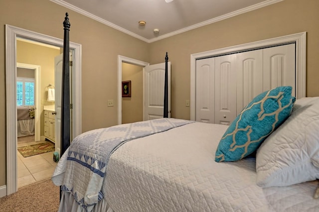 carpeted bedroom with connected bathroom, crown molding, and a closet