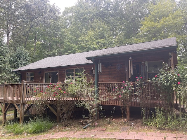 rear view of house with a wooden deck