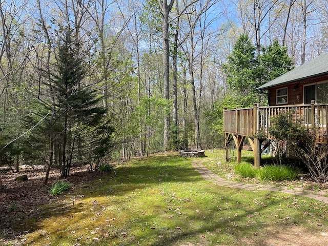 352 Partridge Ln, Murphy, NC 28906 - view of grassy yard with an outdoor fire pit and a wooden deck