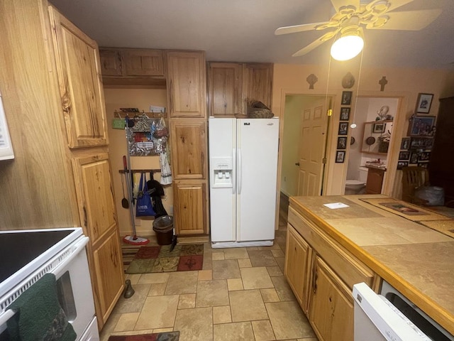 kitchen featuring white appliances and ceiling fan