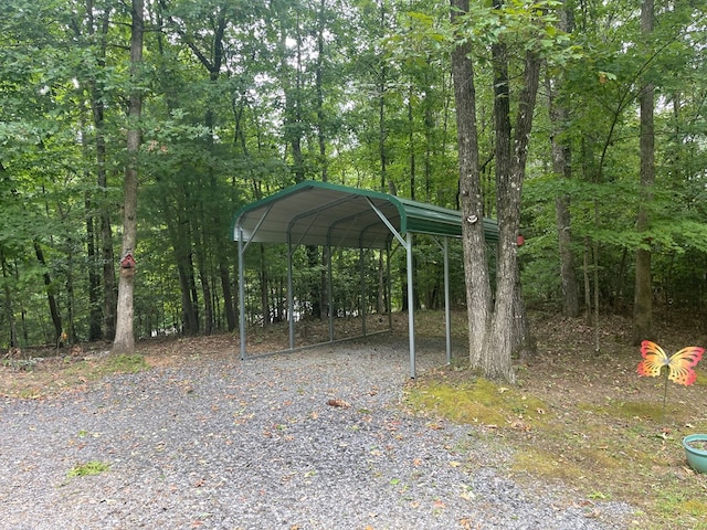 view of vehicle parking with a carport