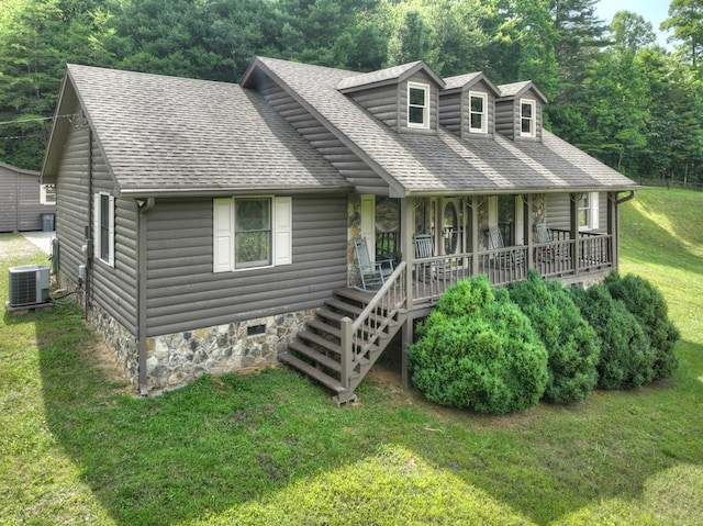 new england style home with a front yard, a porch, and central air condition unit