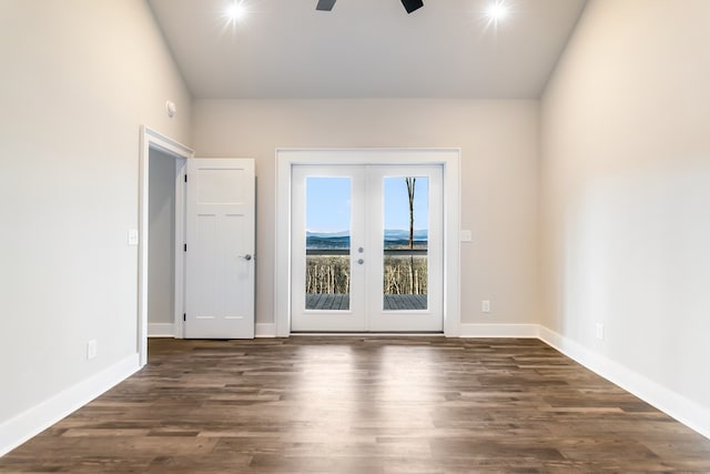 unfurnished room with dark hardwood / wood-style floors, ceiling fan, and french doors