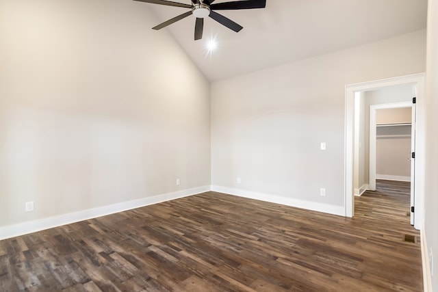 spare room featuring ceiling fan, lofted ceiling, and dark hardwood / wood-style flooring