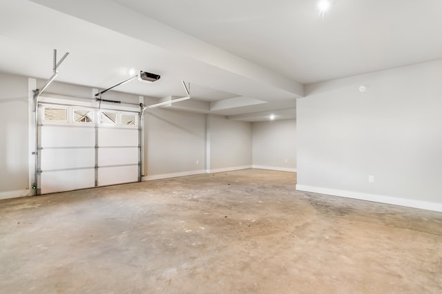 garage featuring baseboards and a garage door opener