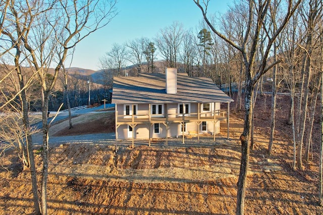 view of front of home featuring a chimney