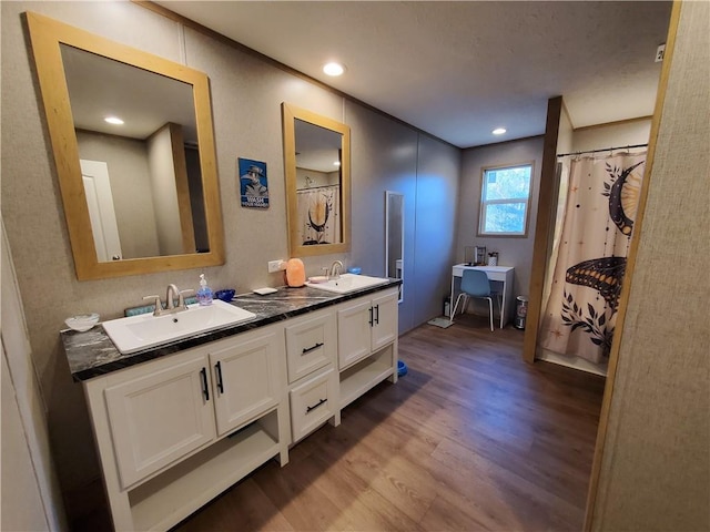 bathroom featuring vanity and wood-type flooring