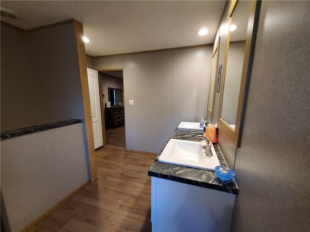 bathroom featuring hardwood / wood-style floors and vanity