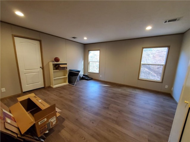 unfurnished living room featuring hardwood / wood-style flooring