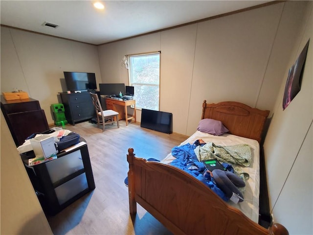 bedroom with light wood-type flooring