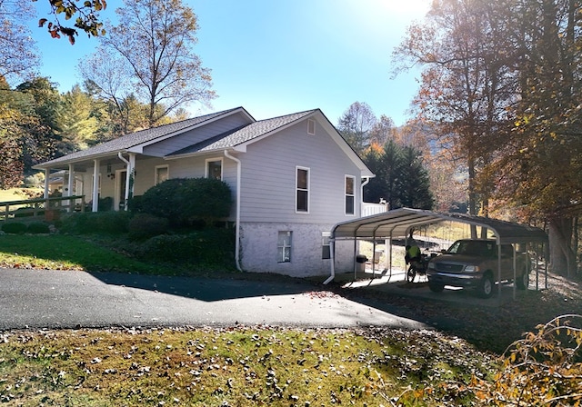 view of home's exterior with a carport