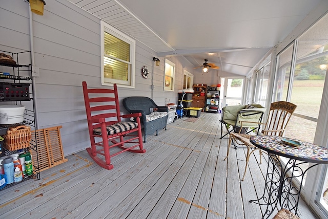 sunroom with vaulted ceiling and ceiling fan