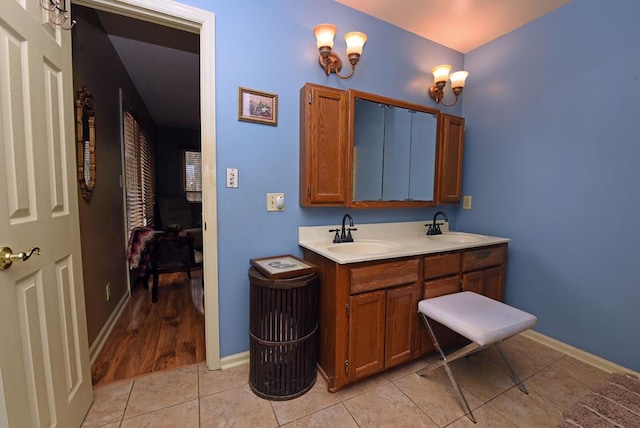 bathroom with vanity and tile patterned flooring