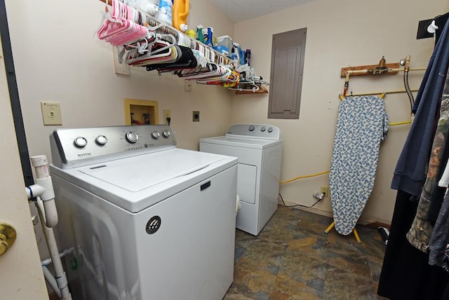 washroom with electric panel and independent washer and dryer