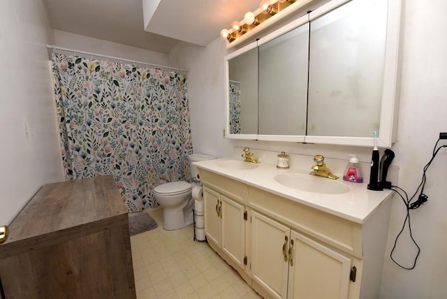 bathroom featuring vanity, toilet, and a shower with shower curtain