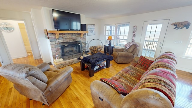 living room featuring light hardwood / wood-style floors and a fireplace