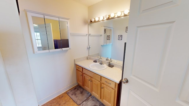 bathroom with vanity and tile flooring