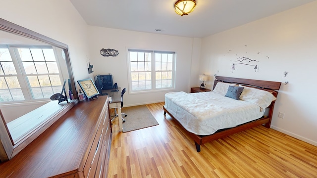 bedroom featuring light wood-type flooring