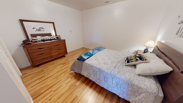 bedroom with light hardwood / wood-style flooring