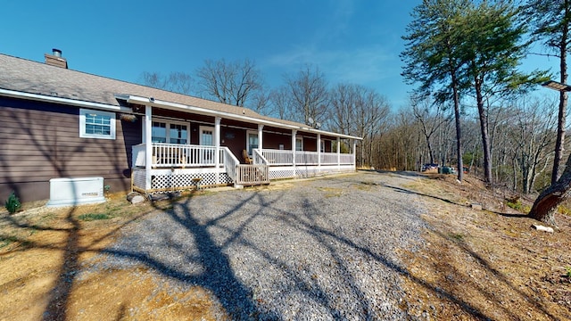 ranch-style home featuring covered porch