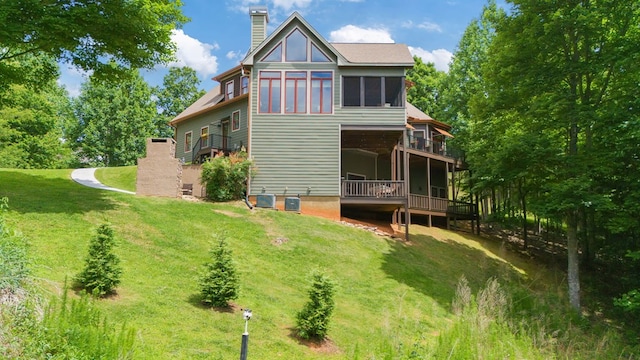 41 Elm Ct, Murphy, NC 28906 - back of house featuring a chimney, a yard, a wooden deck, and a sunroom