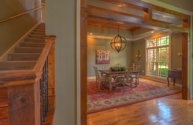 41 Elm Ct, Murphy, NC 28906 - dining space featuring a chandelier, wood finished floors, stairs, ornamental molding, and a raised ceiling