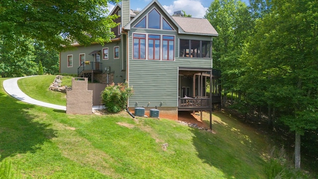 41 Elm Ct, Murphy, NC 28906 - rear view of house featuring a chimney, a yard, and a sunroom
