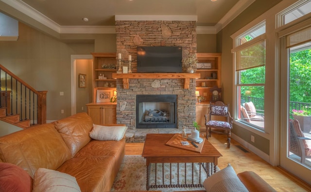 41 Elm Ct, Murphy, NC 28906 - living area with crown molding, wood finished floors, a fireplace, and stairway
