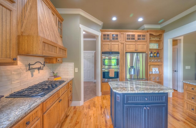 41 Elm Ct, Murphy, NC 28906 - kitchen with appliances with stainless steel finishes, ornamental molding, backsplash, glass insert cabinets, and light wood-style flooring