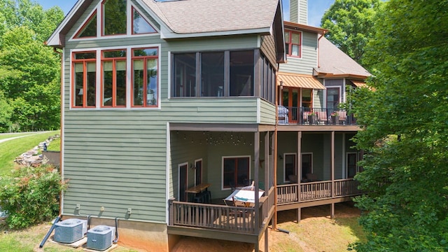41 Elm Ct, Murphy, NC 28906 - back of house with a chimney, a shingled roof, and a sunroom