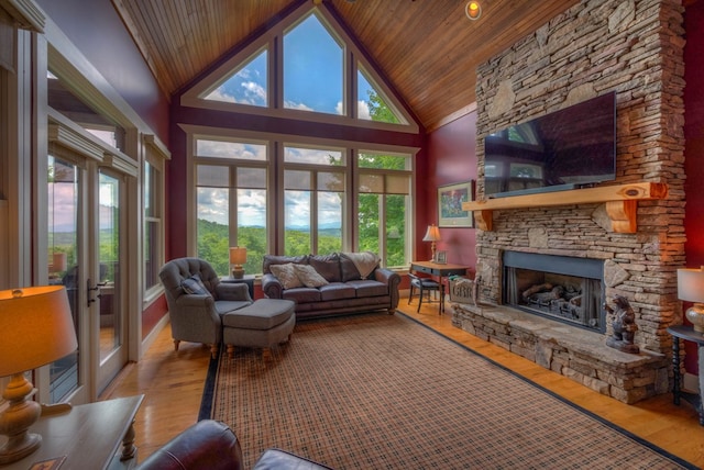 41 Elm Ct, Murphy, NC 28906 - living room featuring wooden ceiling, high vaulted ceiling, a stone fireplace, and wood finished floors