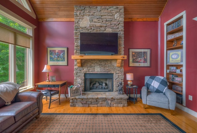 41 Elm Ct, Murphy, NC 28906 - living area featuring wooden ceiling, wood finished floors, a stone fireplace, and lofted ceiling