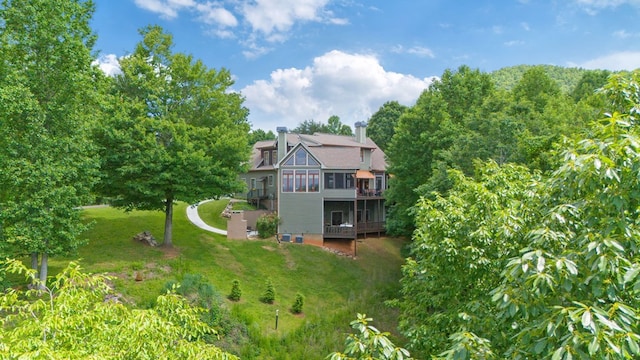 41 Elm Ct, Murphy, NC 28906 - back of property with a sunroom, a yard, a chimney, and a wooden deck