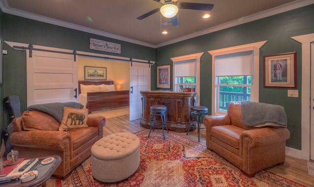 41 Elm Ct, Murphy, NC 28906 - living area featuring a barn door, a ceiling fan, crown molding, wood finished floors, and recessed lighting