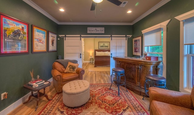 41 Elm Ct, Murphy, NC 28906 - living area with a barn door, wood finished floors, ornamental molding, a dry bar, and recessed lighting