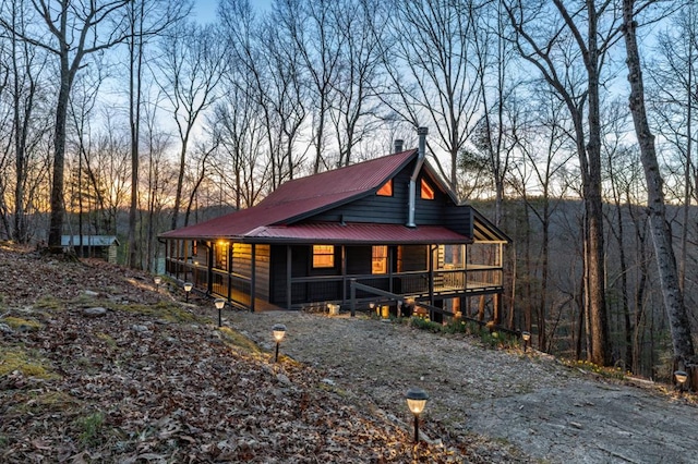 318 Buck Ridge Rd, Suches, GA 30572 - chalet / cabin with metal roof, a porch, and a chimney