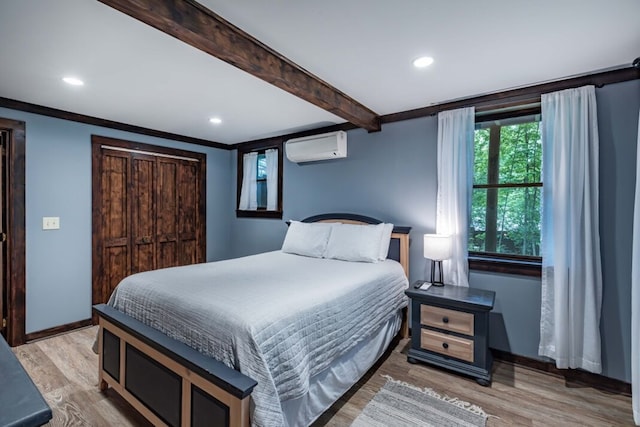318 Buck Ridge Rd, Suches, GA 30572 - bedroom featuring light wood finished floors, baseboards, beamed ceiling, a wall unit AC, and recessed lighting