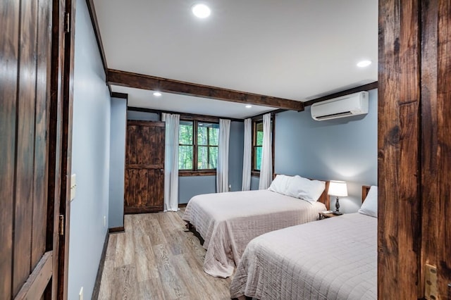 318 Buck Ridge Rd, Suches, GA 30572 - bedroom featuring beam ceiling, recessed lighting, light wood-style flooring, and an AC wall unit