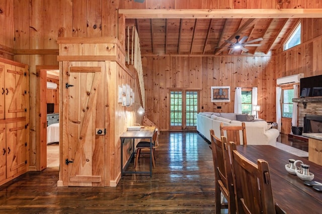 318 Buck Ridge Rd, Suches, GA 30572 - dining space with wood walls, a healthy amount of sunlight, and dark wood-style flooring
