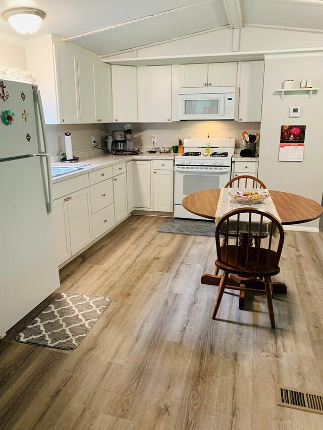 details with hardwood / wood-style flooring and heating unit