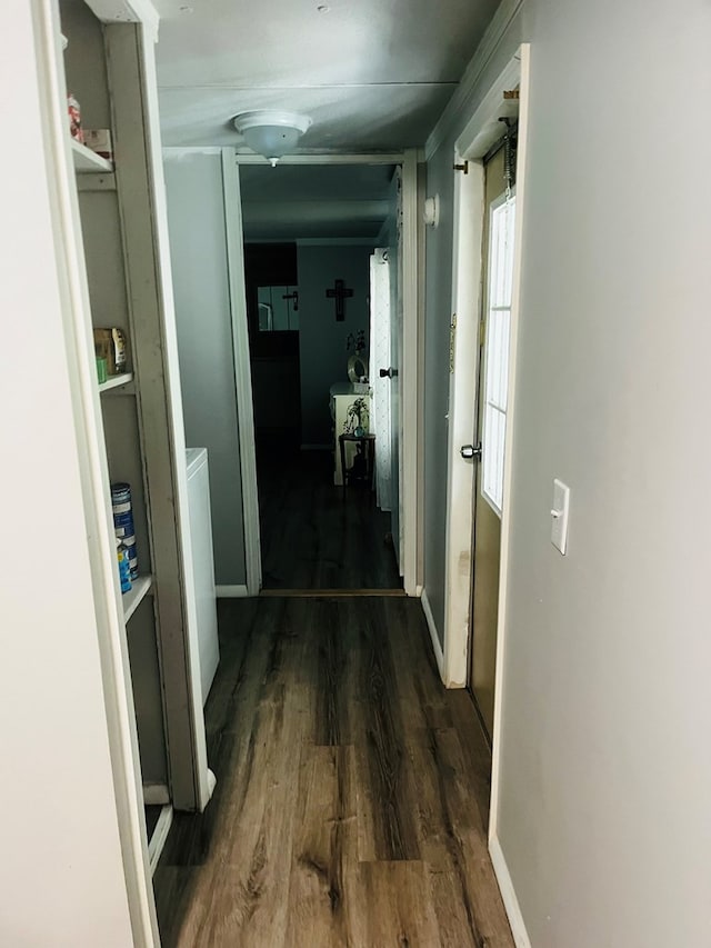 corridor featuring dark hardwood / wood-style floors