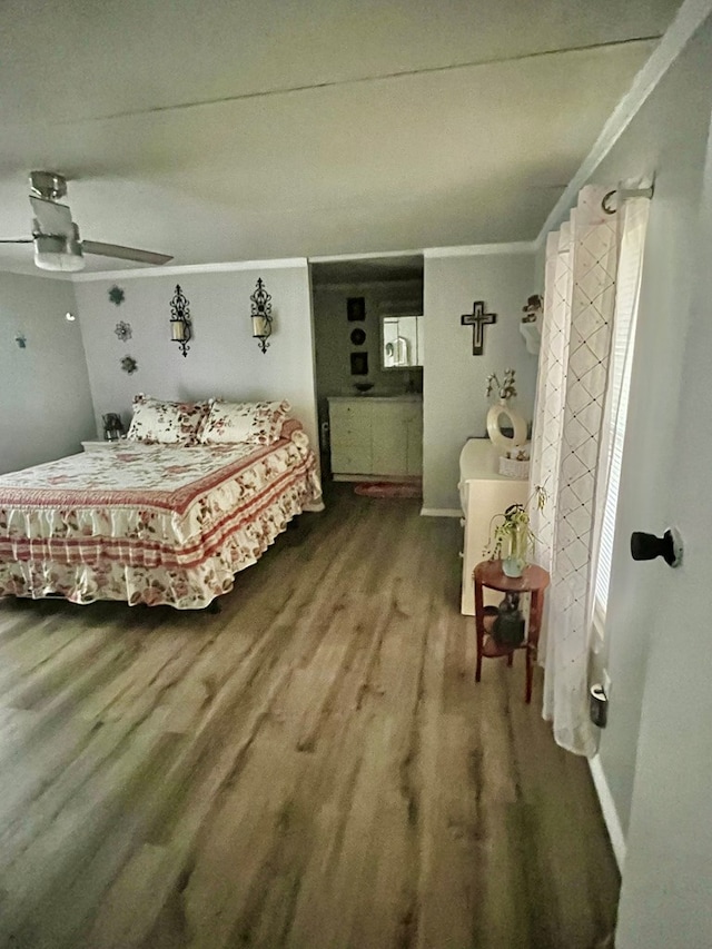 bedroom with ornamental molding, wood-type flooring, and ceiling fan