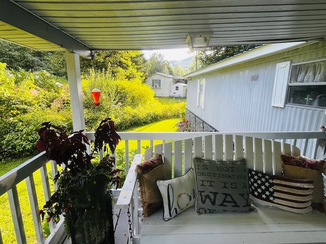 wooden balcony featuring a wooden deck