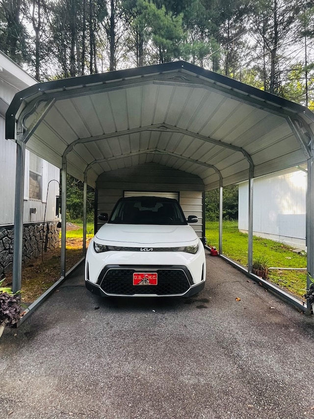 view of vehicle parking with a carport