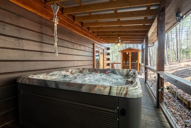 wooden terrace featuring a hot tub