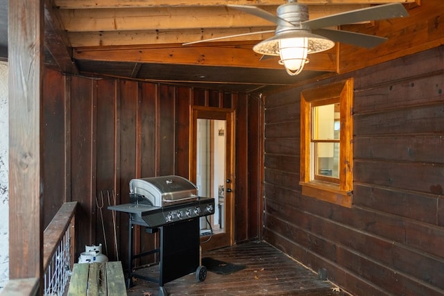 interior space with wood walls and hardwood / wood-style floors