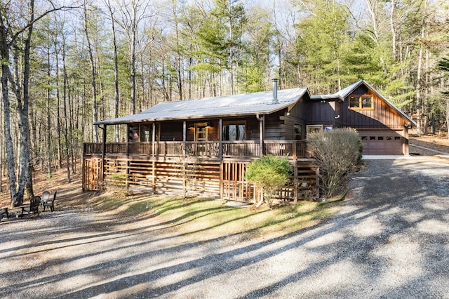 view of front facade with a garage and covered porch