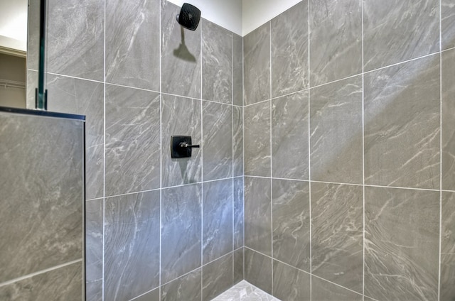 bathroom with tiled shower