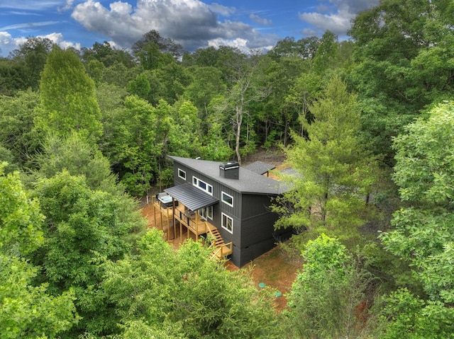 drone / aerial view featuring a forest view